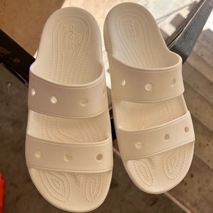 White Crocs slides